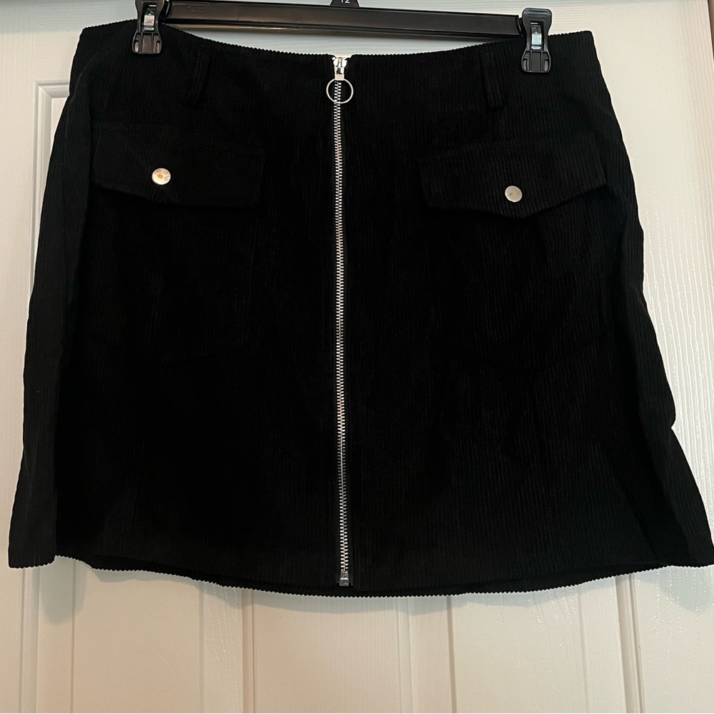 Black corduroy front zip skirt